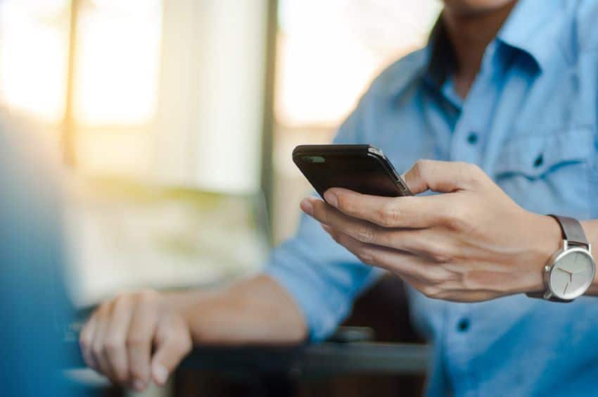Man changing habits to improve sperm quality and avoid mobile phone heat.