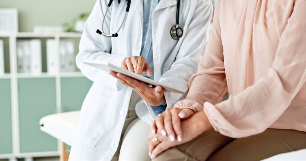 A doctor providing consultation about bloating during ovulation